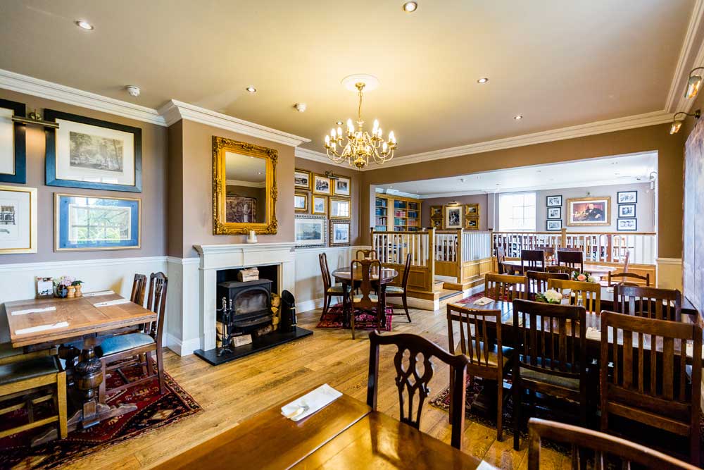 Warm restaurant seating area in The Celtic Arms, Northop